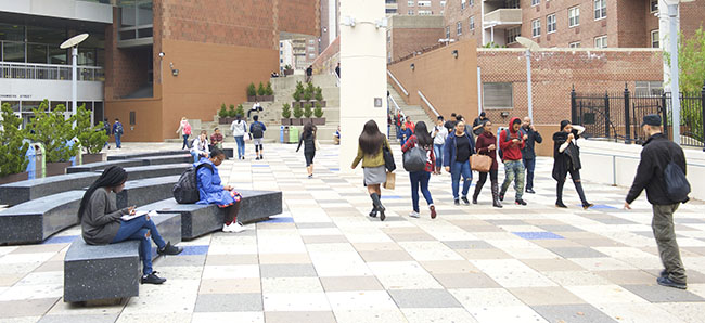 students walking across BMCC campus