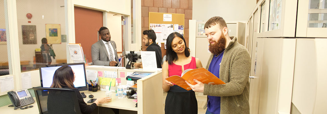 student and counselor at Career Center counter