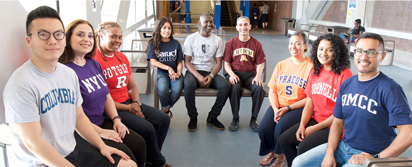 students wearing tee shirts from various colleges