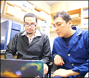 student and professor in lab