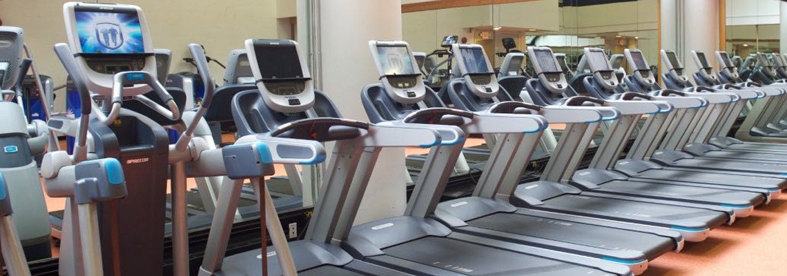 row of stationary exercise machines