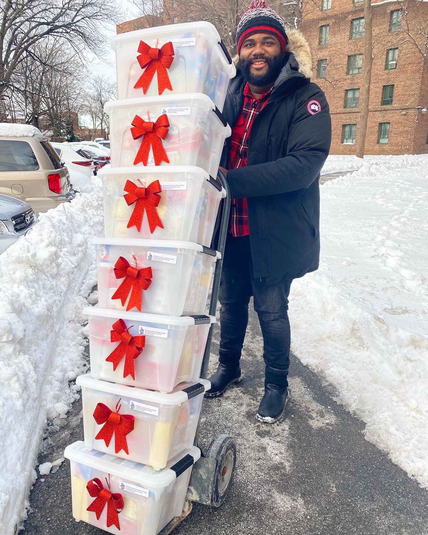 BMCC alumnus Jamel Holmes delivers school supplies to his students