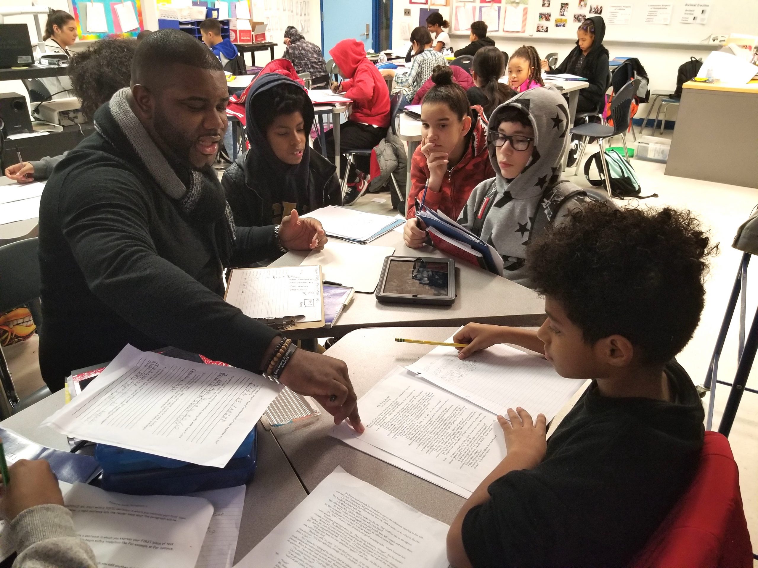 BMCC alumnus Jamel Holmes working with middle school students.