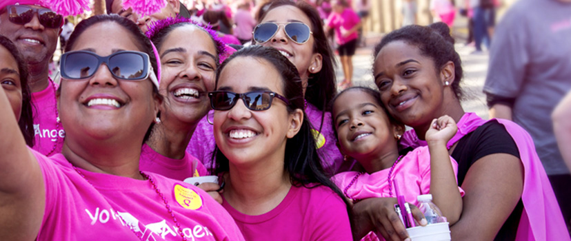 women in pink tee shirts at Breast Cancer Walk event