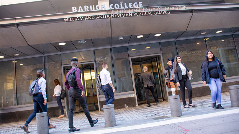 students walking in front of Baruch College building