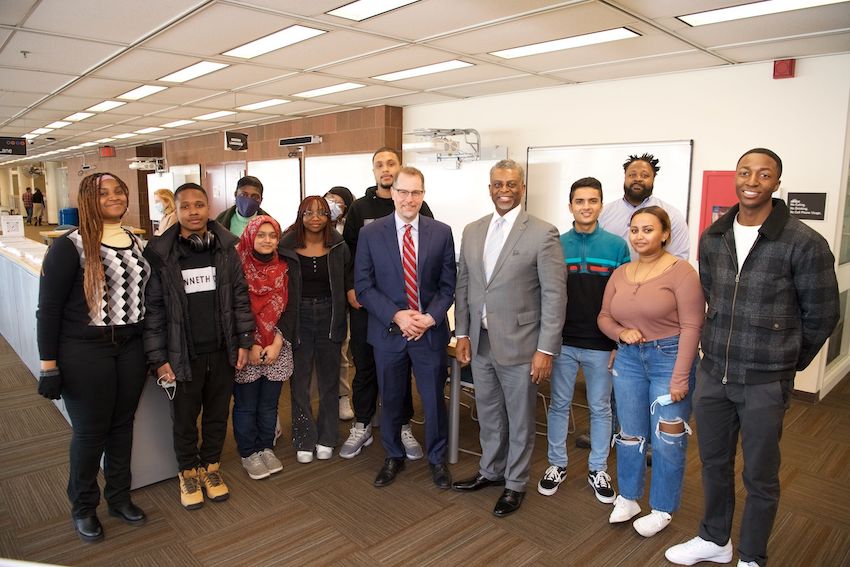 BMCC President Anthony Munroe, students and staff in the BMCC Library.
