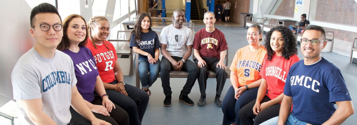 students wearing tee shirts from different colleges