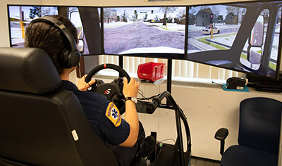 Paramedic student learning to drive an ambulance using the ambulance simulator