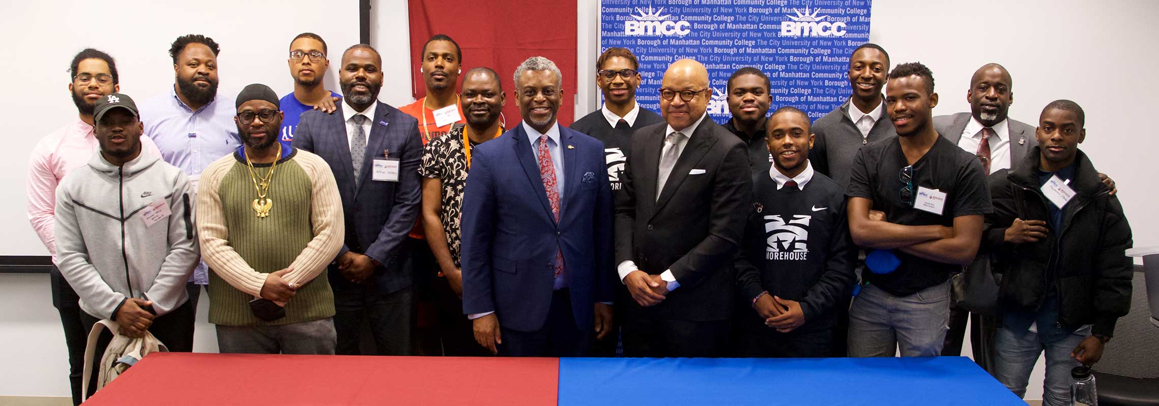 BMCC and Morehouse administrators and students at signing table