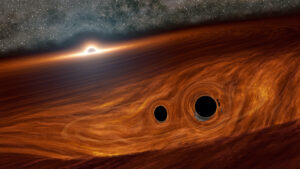 Little Black Holes in Disk of Big Black Hole/ Image credit Caltech/R. Hurt (IPAC)