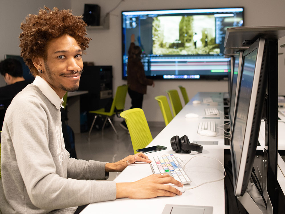 Student at desk, computer lab