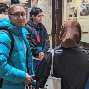 Students read wall displays in addition to taking an audio tour of the Eastern State Penitentiary historic site.