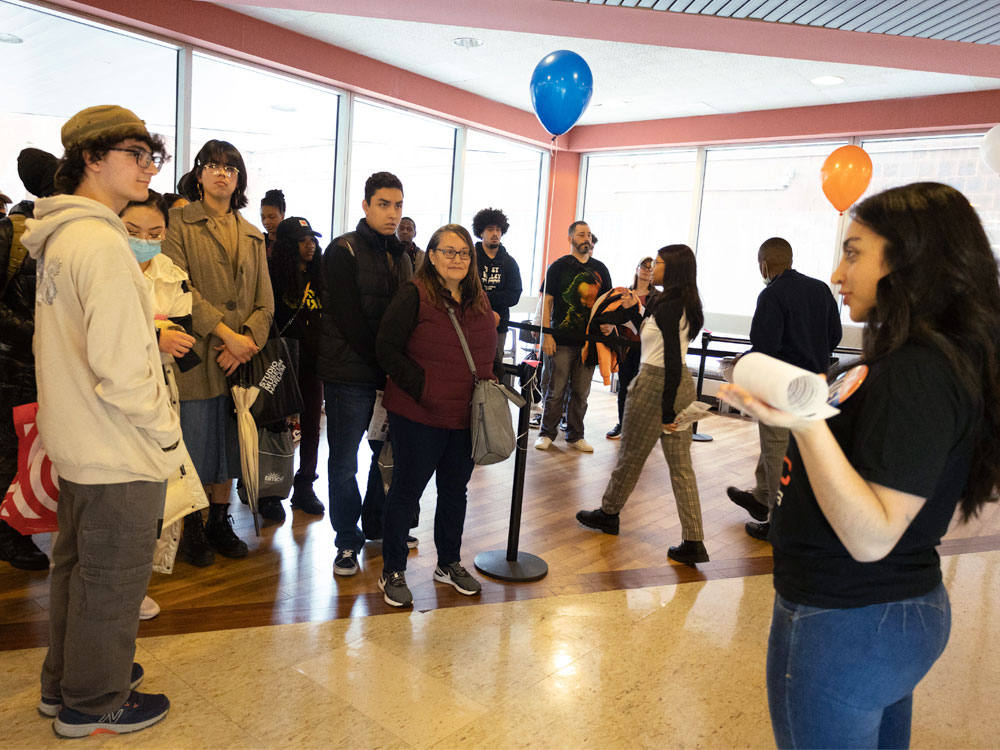 Female leading a campus tour