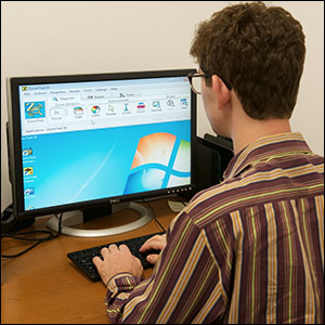 student using computer with screen enlarging software