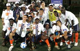 BMCC's men's soccer team celebrates victory.