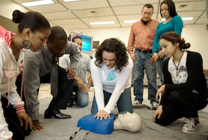 <b>Michelle Seppinni practices CPR while instructor Cpl. Benoit Coumin, left, and others in the class look on.</b> 