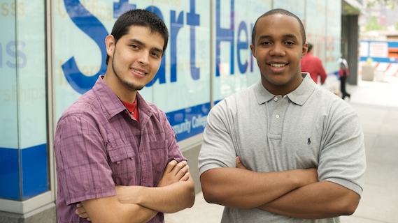 The newest Kaplan scholars, Wilson Acuna and David Thelemaque, strike a pose.